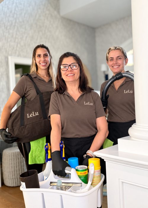 LeLu Cleaning team with supplies and vacuum